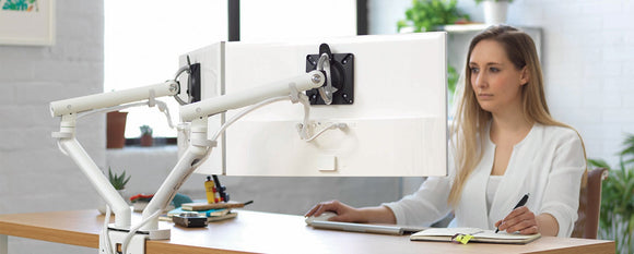 Dual Flo monitor arms in an office setting